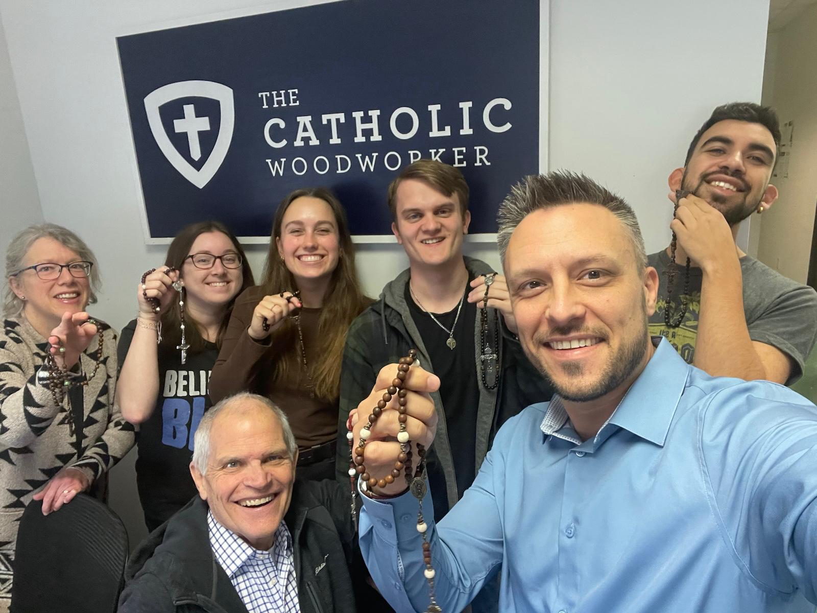 The Catholic Woodworker team holding their favorite rosaries.